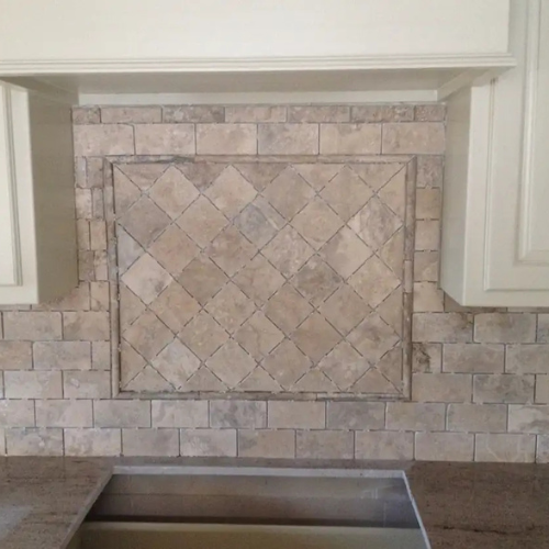 Rustic tile backsplash in a kitchen